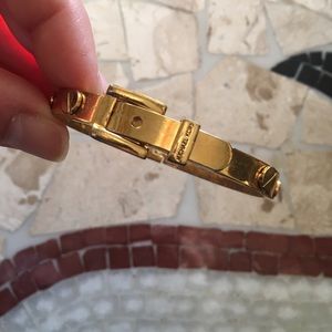 MK Gold toned buckle bracelet with screw detail